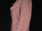 an image of a pink jacket on a mannequin stand