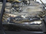a silver statue of a man and a woman on a boat