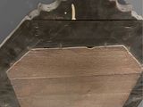 a candle that is lit in a wooden box