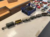 a table with a bunch of toy trains on it