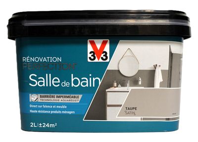 le pot de peinture est blanc et est muni d'un couvercle noir