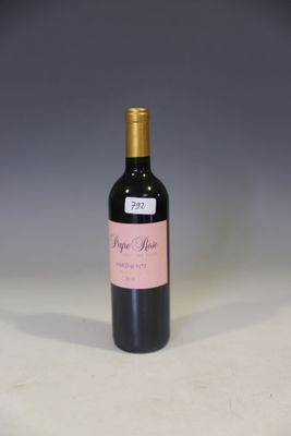 a bottle of wine that is sitting on a table