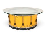 an image of a yellow and black coffee table with a glass top