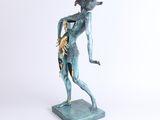 a statue of a woman with a snake on her shoulder