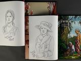 three books that are sitting on a table