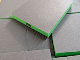 several pieces of gray foam sitting on top of a wooden table