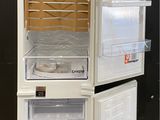 an image of a white refrigerator with its doors open