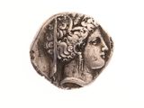 l'image d'une pièce d'argent sur laquelle figure le visage d'une femme