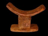 an image of a wooden sculpture on a black background