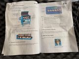 an open book with instructions on how to use a machine