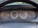 a close up of a car dashboard with a speedometer