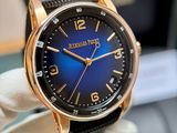 a close up of a wrist watch with a blue dial