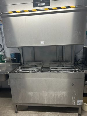 a machine that is sitting in a kitchen with a lot of counter space