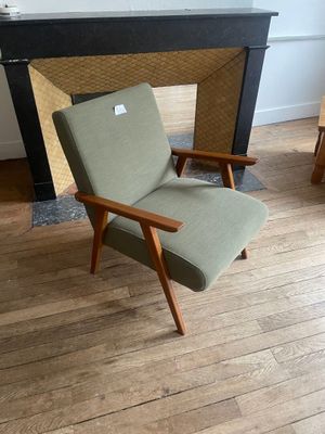 a chair that is sitting in front of a fire place