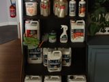 a shelf with several different types of cleaning products on it