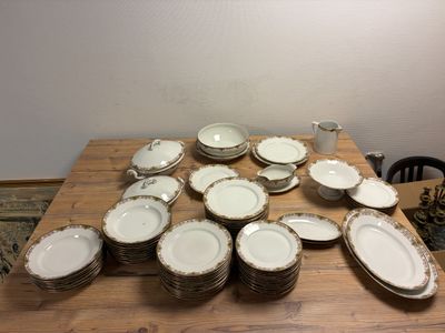 a lot of plates and cups on the table