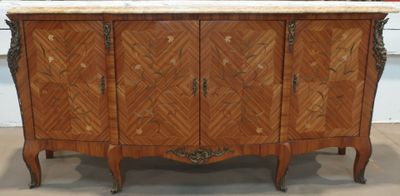 a wooden cabinet with marble top in a room
