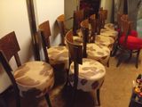 many chairs that are lined up in a row