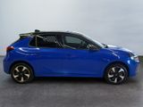 a blue car with a surfboard on top of it