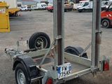 a trailer with a trailer attached to it in a parking lot