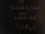 a close up of a blackboard with writing on it
