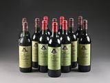 six bottles of wine are lined up in a row on a table