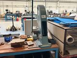 a machine that is sitting on a table in a warehouse