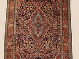 an antique persian rug with a floral design