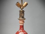 a lamp that is sitting on a stand on a table