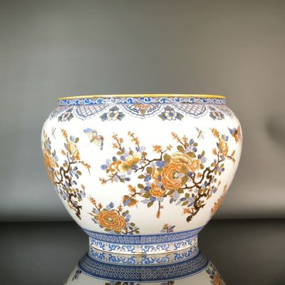 a white bowl with blue and yellow flowers on it