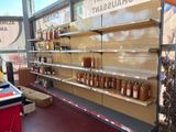 many jars of food on the shelves in the store