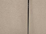 a close up of a golf club and a ball on a table