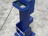 an image of a blue trash can on a concrete floor