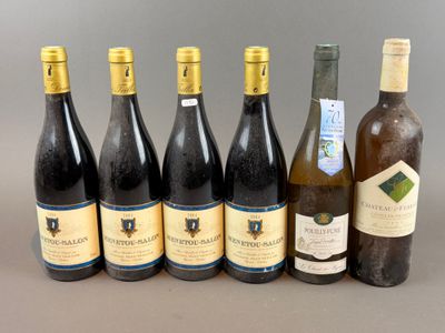 several bottles of wine are lined up on a table