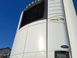 a large white truck with a large air conditioner on the back of it