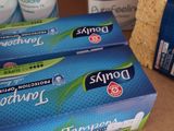 a box of toothpaste next to a package of toothpaste