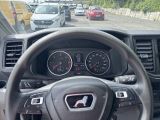 a dashboard of a car with a lot of cars in the background