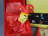 a red box with a clown mask inside of it