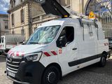a white van that is parked in front of a building