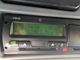 a close up of a radio in a car ' s dashboard