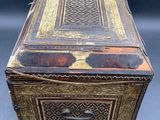 an old wooden box sitting on top of a table