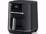 a black air fryer sitting on top of a white surface