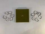 an image of a green box with a green cover next to a pair of silver circles