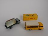 a small toy truck next to a small toy truck