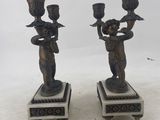 pair of antique bronze figurines on marble bases