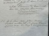 an old document with writing on it sitting on a table