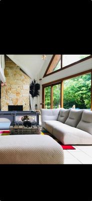 a picture of a living room with couches and a fire place