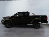 a picture of a black truck parked in a garage