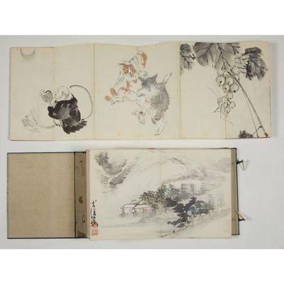 three chinese ink paintings of birds and flowers on a book