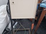 a metal cabinet that has a price tag on it